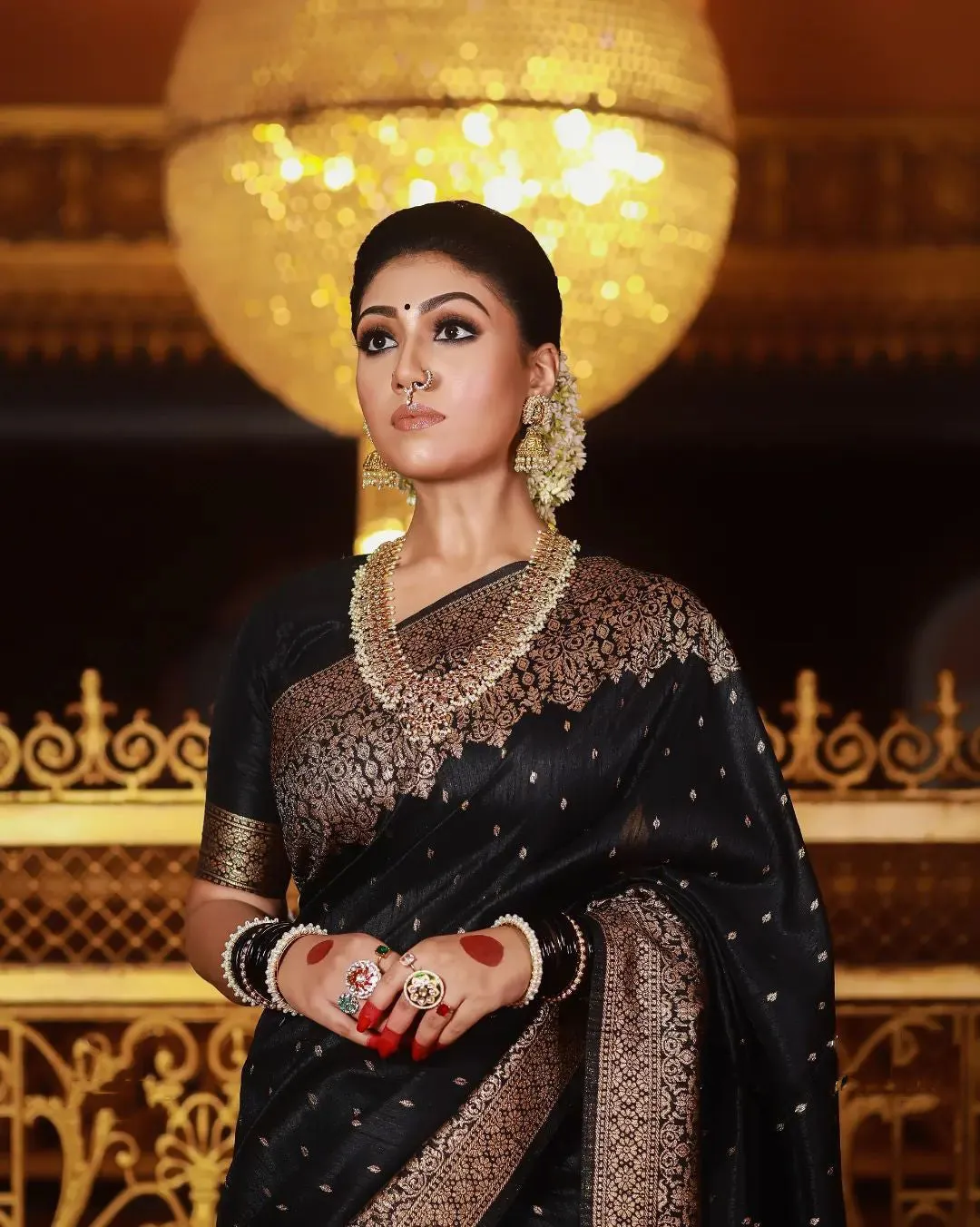 A dreamy Black Soft Banarasi silk saree With Lissome Blouse Piece